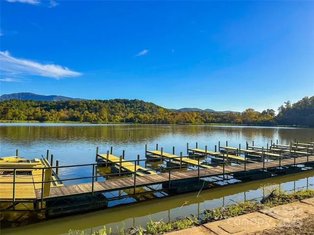 a building outdoor space with patio furniture and swimming pool