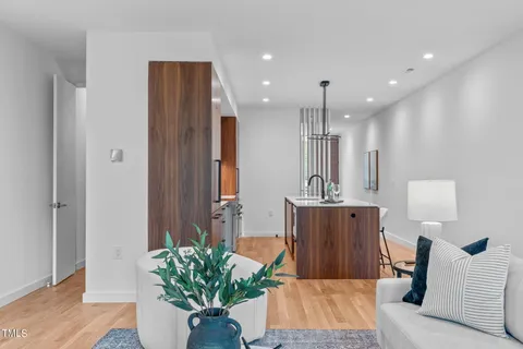 a view of entryway and hall with wooden floor