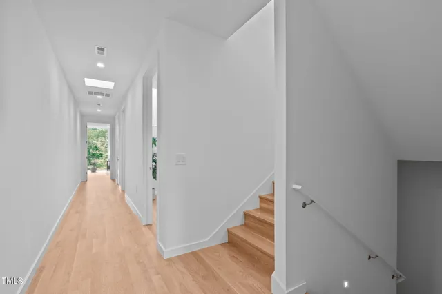 a bedroom with a bed and a potted plant