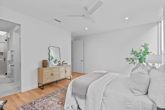 a bathroom with a double vanity sink mirror and shower