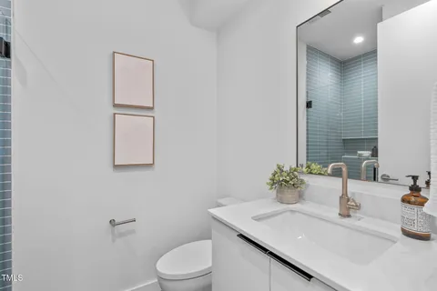 a living room with a couch and a rug