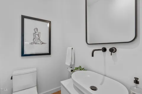 an aerial view of multiple houses with a yard