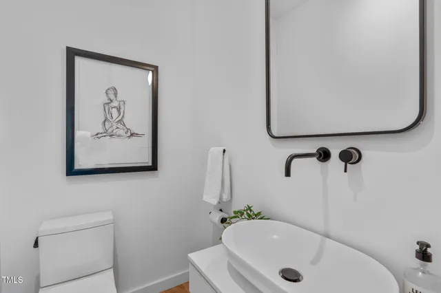 an aerial view of multiple houses with a yard