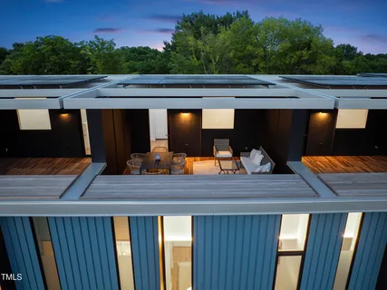 a front view of a house with a yard outdoor seating and entertaining space