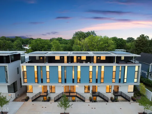 a view of a city that has lawn chairs and a table