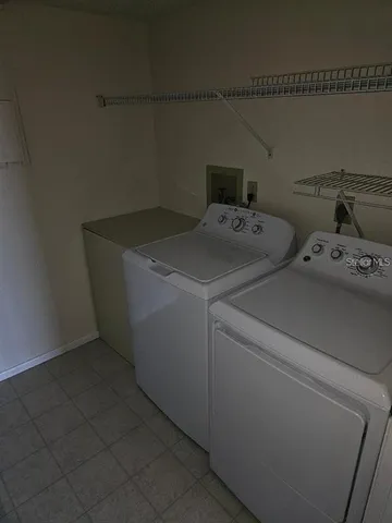 a view of a room that has a bed in it