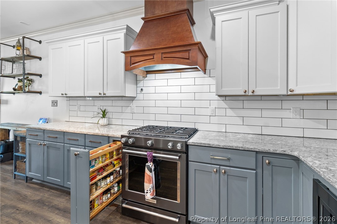 5535 Butler Nursery Road Fayetteville, NC 28306 - Photo 14 of 50 a kitchen with cabinets appliances and a counter top space