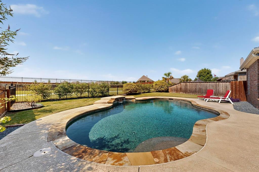 1240 Wedgewood Drive Forney, TX 75126 - Photo 1 of 40 a view of swimming pool having outdoor seating