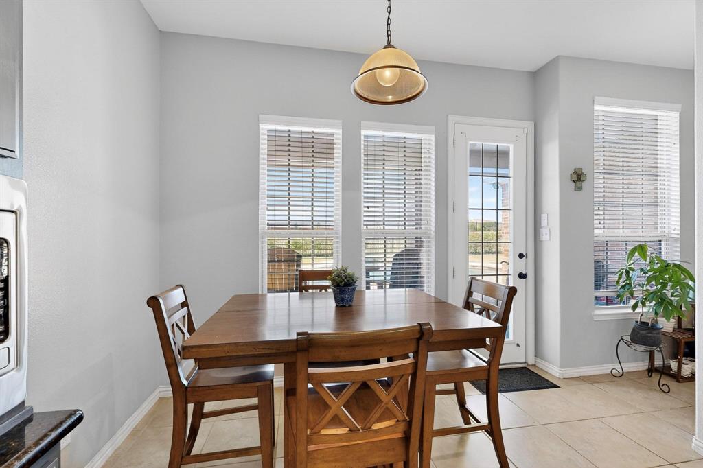1240 Wedgewood Drive Forney, TX 75126 - Photo 16 of 40 a view of a dining room with furniture window and outside view