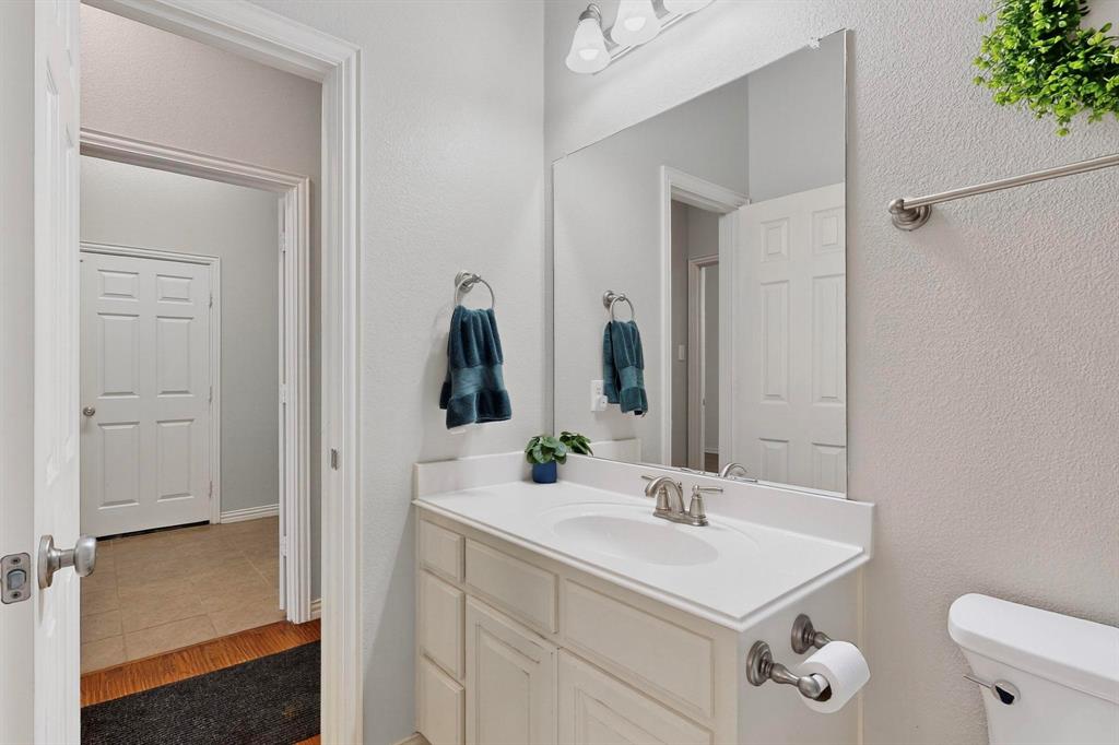 1240 Wedgewood Drive Forney, TX 75126 - Photo 17 of 40 a bathroom with a sink toilet and shower