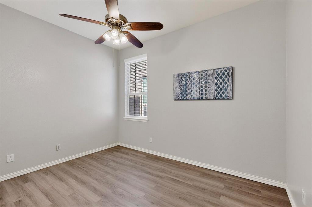 1240 Wedgewood Drive Forney, TX 75126 - Photo 27 of 40 wooden floor in an empty room with a window