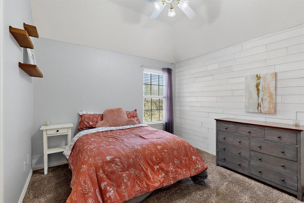 1240 Wedgewood Drive Forney, TX 75126 - Photo 34 of 40 a bedroom with a bed and window