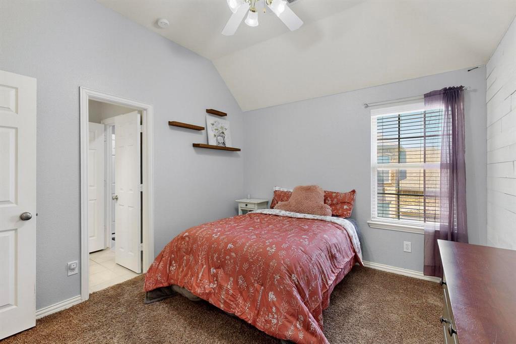 1240 Wedgewood Drive Forney, TX 75126 - Photo 35 of 40 a bedroom with a bed and a window