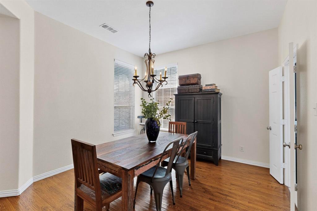 1240 Wedgewood Drive Forney, TX 75126 - Photo 5 of 40 a view of a dining room with a table and chairs