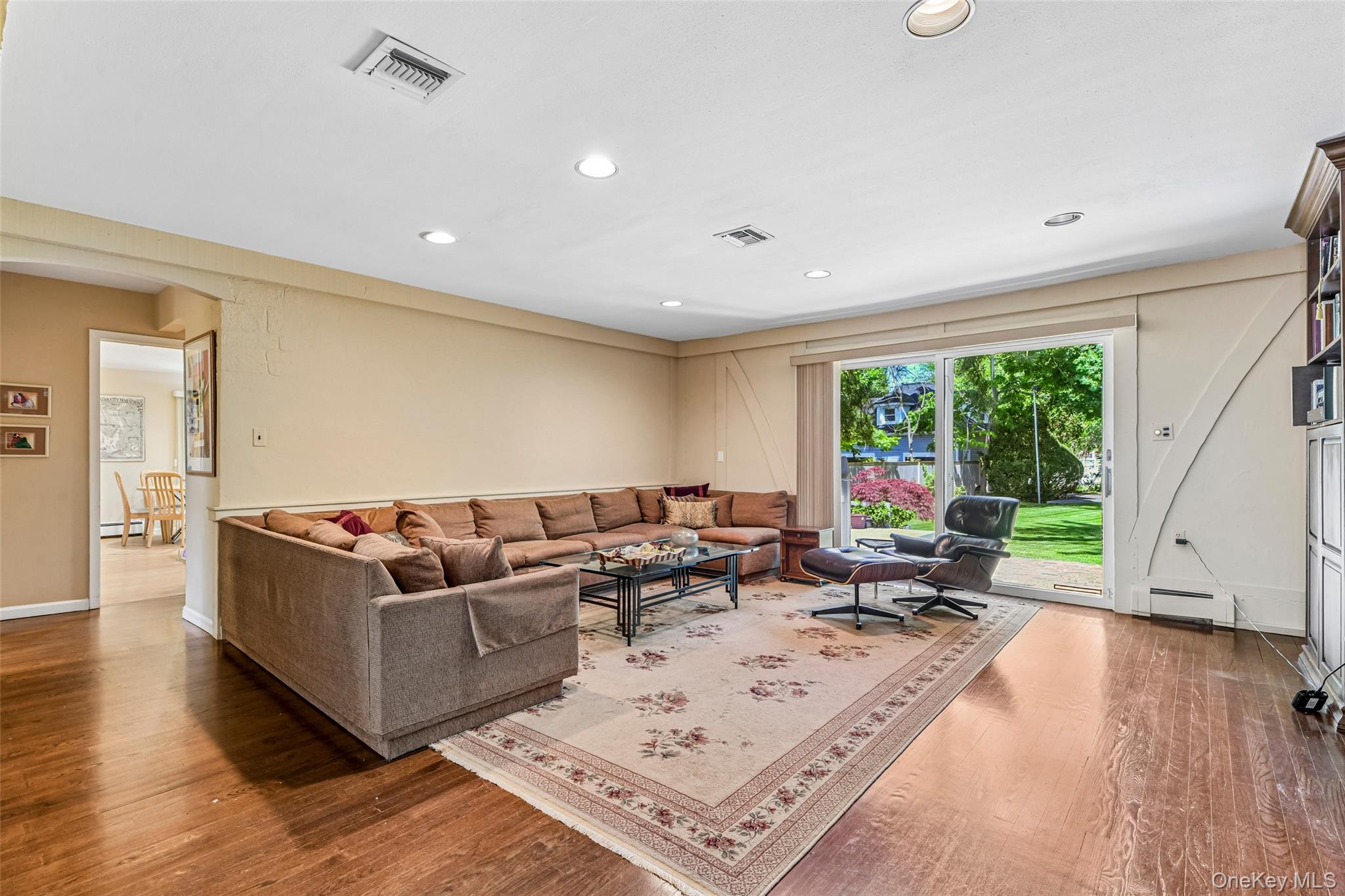 100 Hewlett Neck Road Woodmere, NY 11598 - Photo 18 of 45 a living room with furniture and a large window