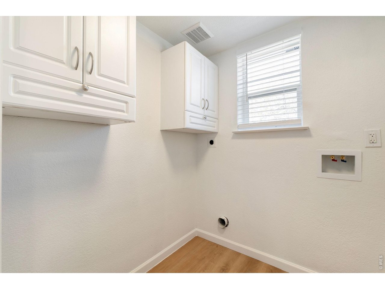 5761 Ceylon Street Denver, CO 80249 - Photo 11 of 29 Main level laundry room.