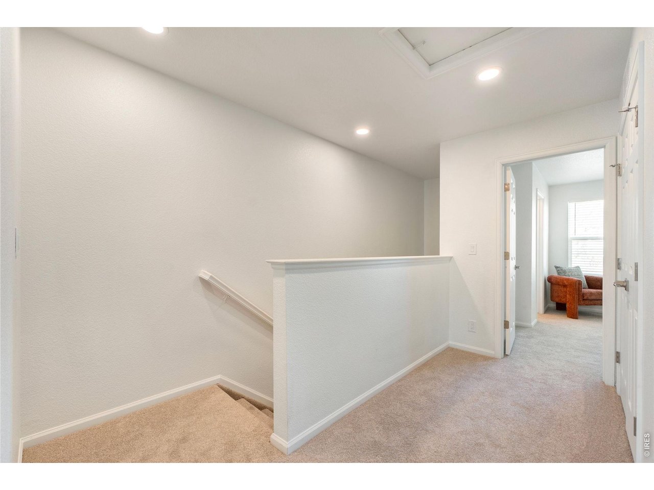 5761 Ceylon Street Denver, CO 80249 - Photo 12 of 29 2nd level hallway with mechanical closet.