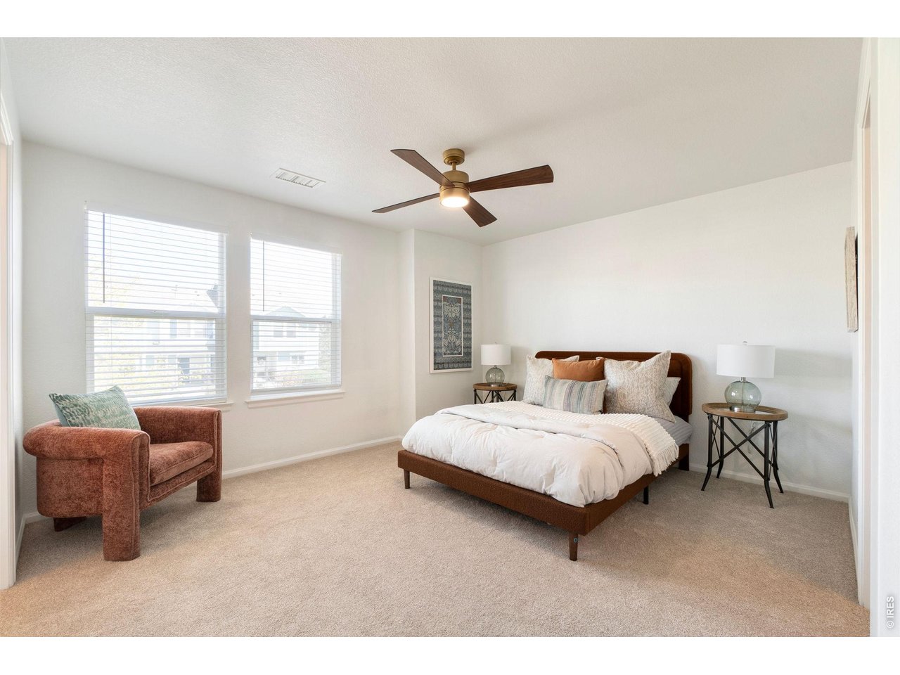 5761 Ceylon Street Denver, CO 80249 - Photo 13 of 29 Cozy and spacious primary bedroom retreat with abundant natural light.