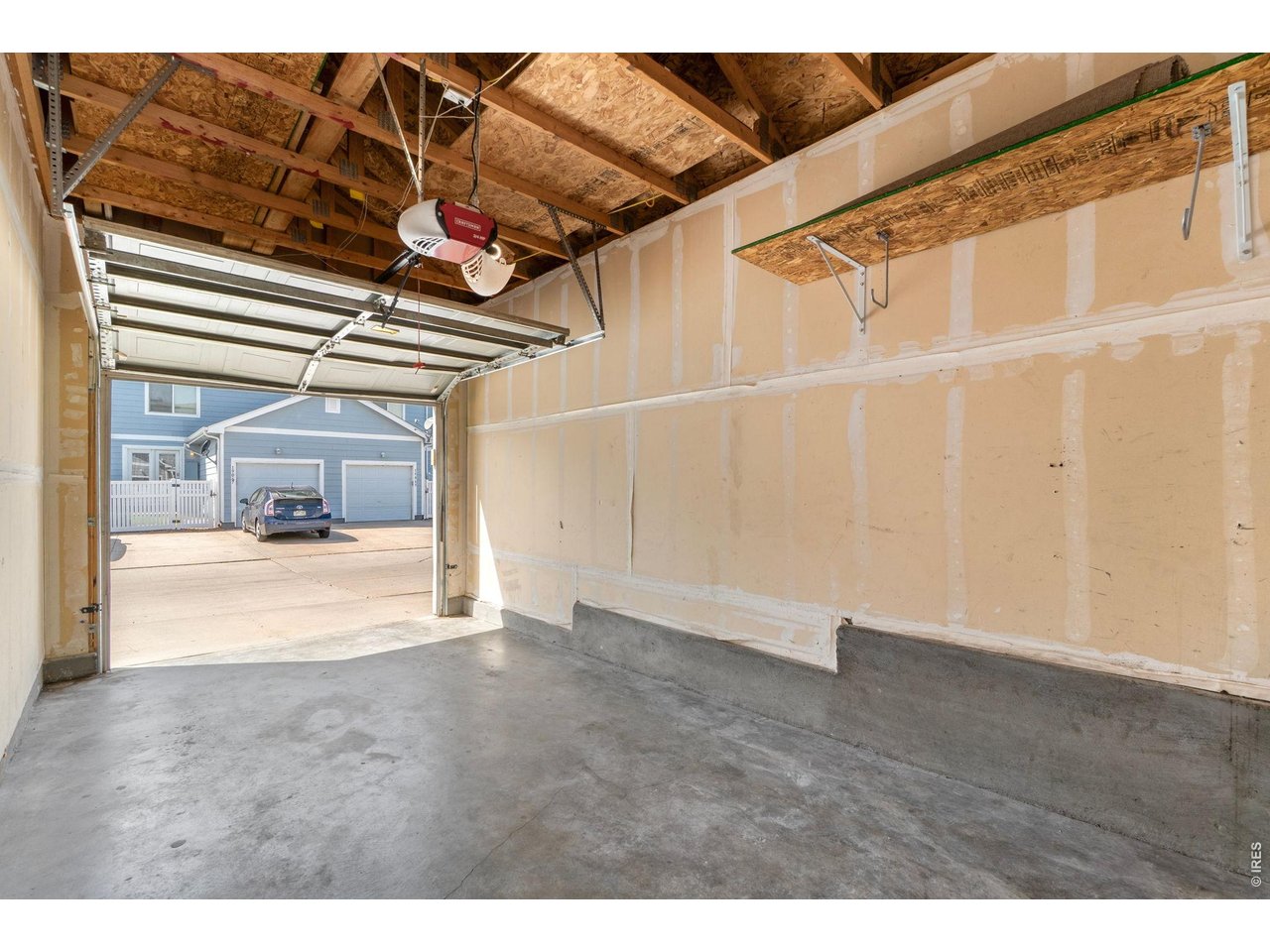 5761 Ceylon Street Denver, CO 80249 - Photo 25 of 29 Attached garage with plenty of space for parking and storage.