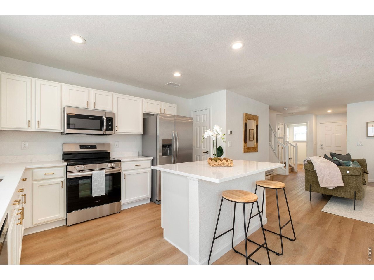 5761 Ceylon Street Denver, CO 80249 - Photo 7 of 29 A fresh, modern kitchen with sleek finishes and a spacious island for gathering.