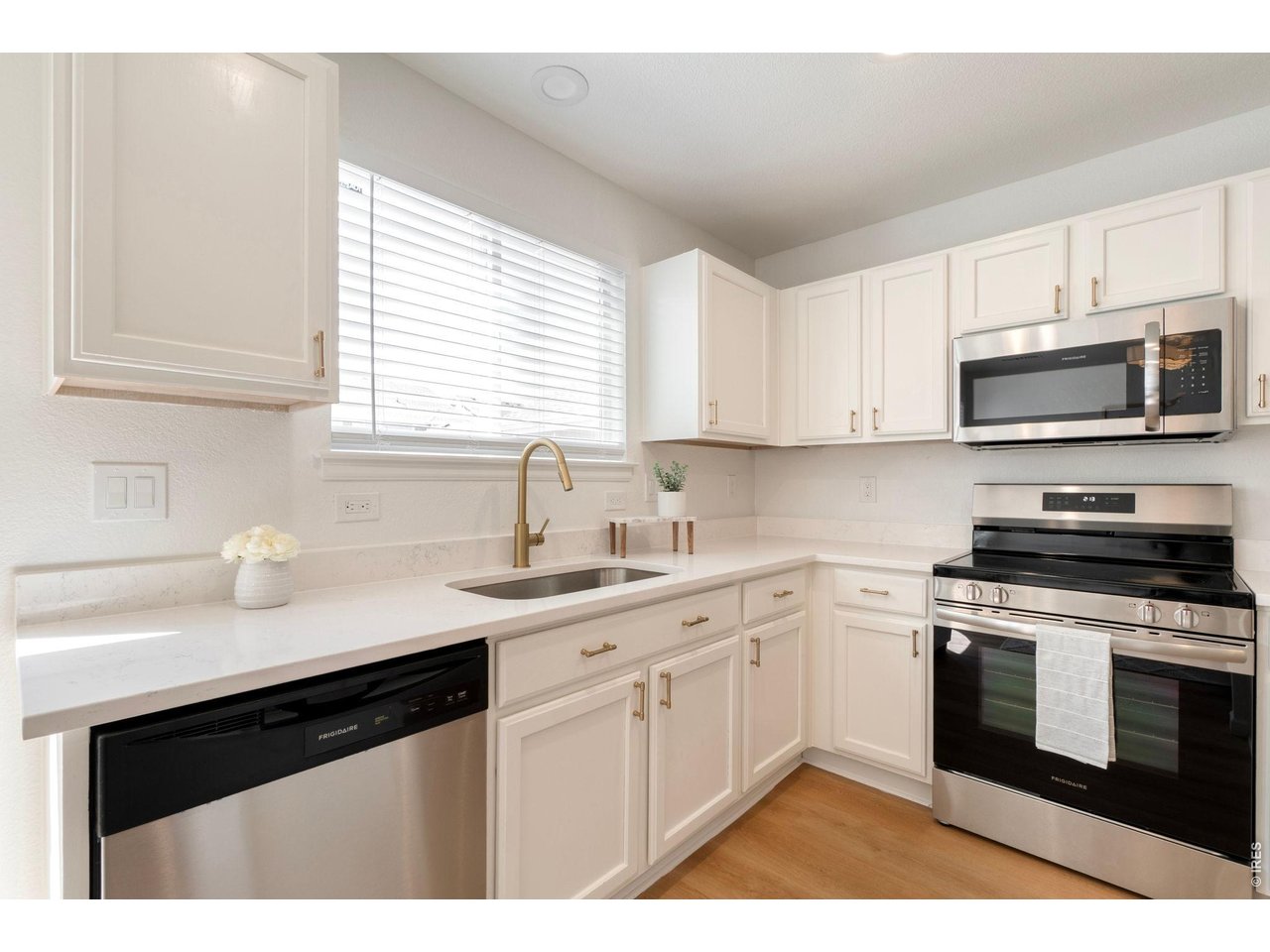 5761 Ceylon Street Denver, CO 80249 - Photo 8 of 29 New quartz counters and new appliances and hardware.