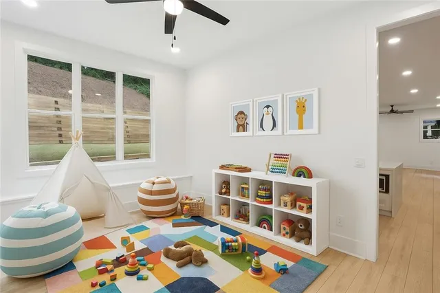 a bedroom with furniture and a book shelf