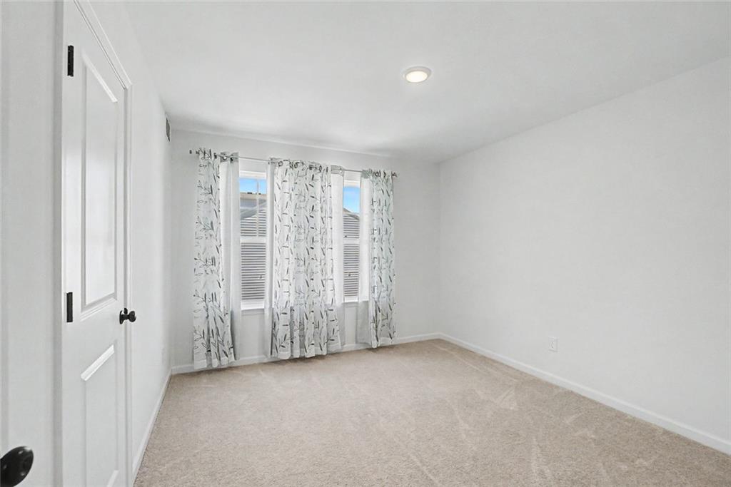 2310 Portrush Way Southeast Atlanta, GA 30339 - Photo 35 of 38 an empty room with windows