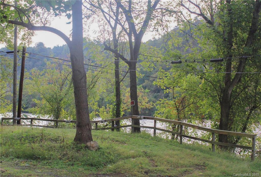 9999 Redmon Road Marshall, NC 28753 - Photo 3 of 11 a view of outdoor space with a garden and trees