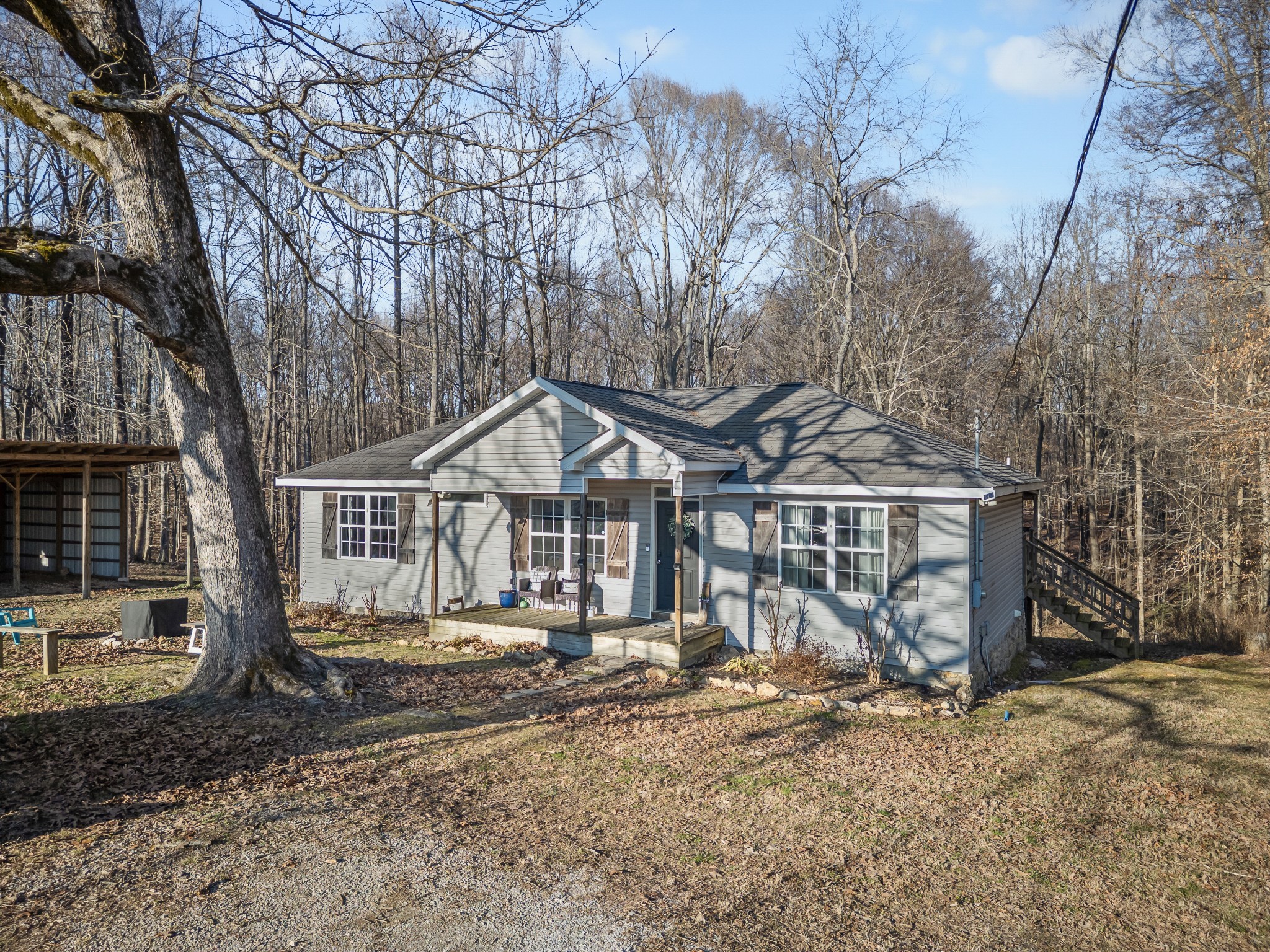590 Jackson Hollow Road Goodspring, TN 38460 - Photo 1 of 37 a view of a house with a yard covered in snow