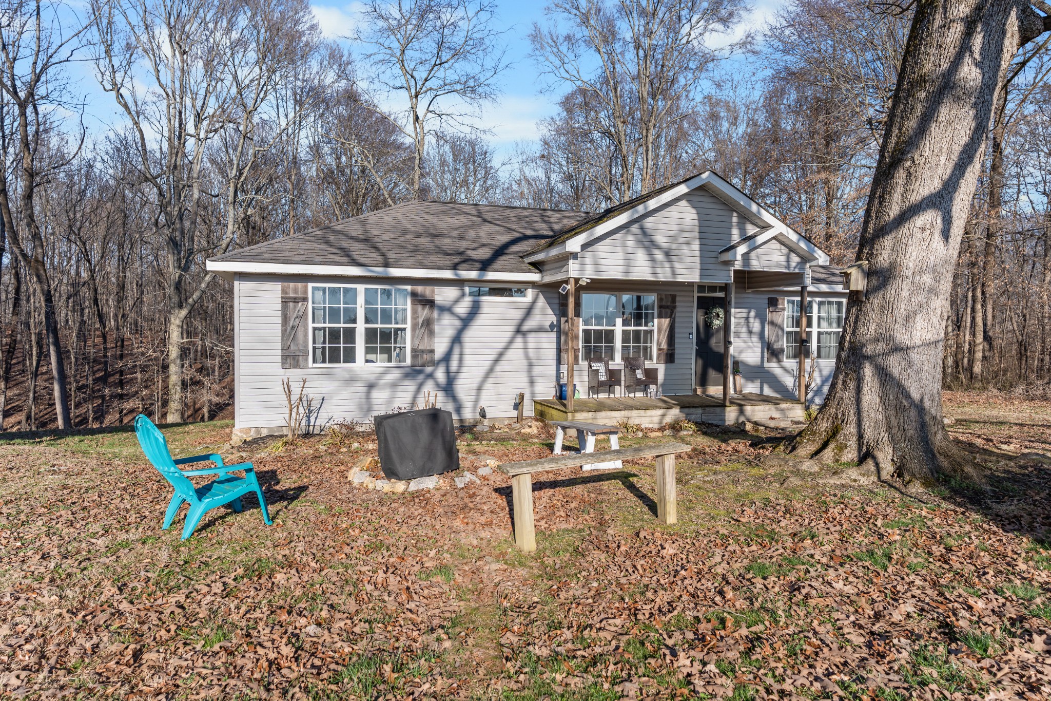 590 Jackson Hollow Road Goodspring, TN 38460 - Photo 11 of 37 a wooden bench sitting in front of a house