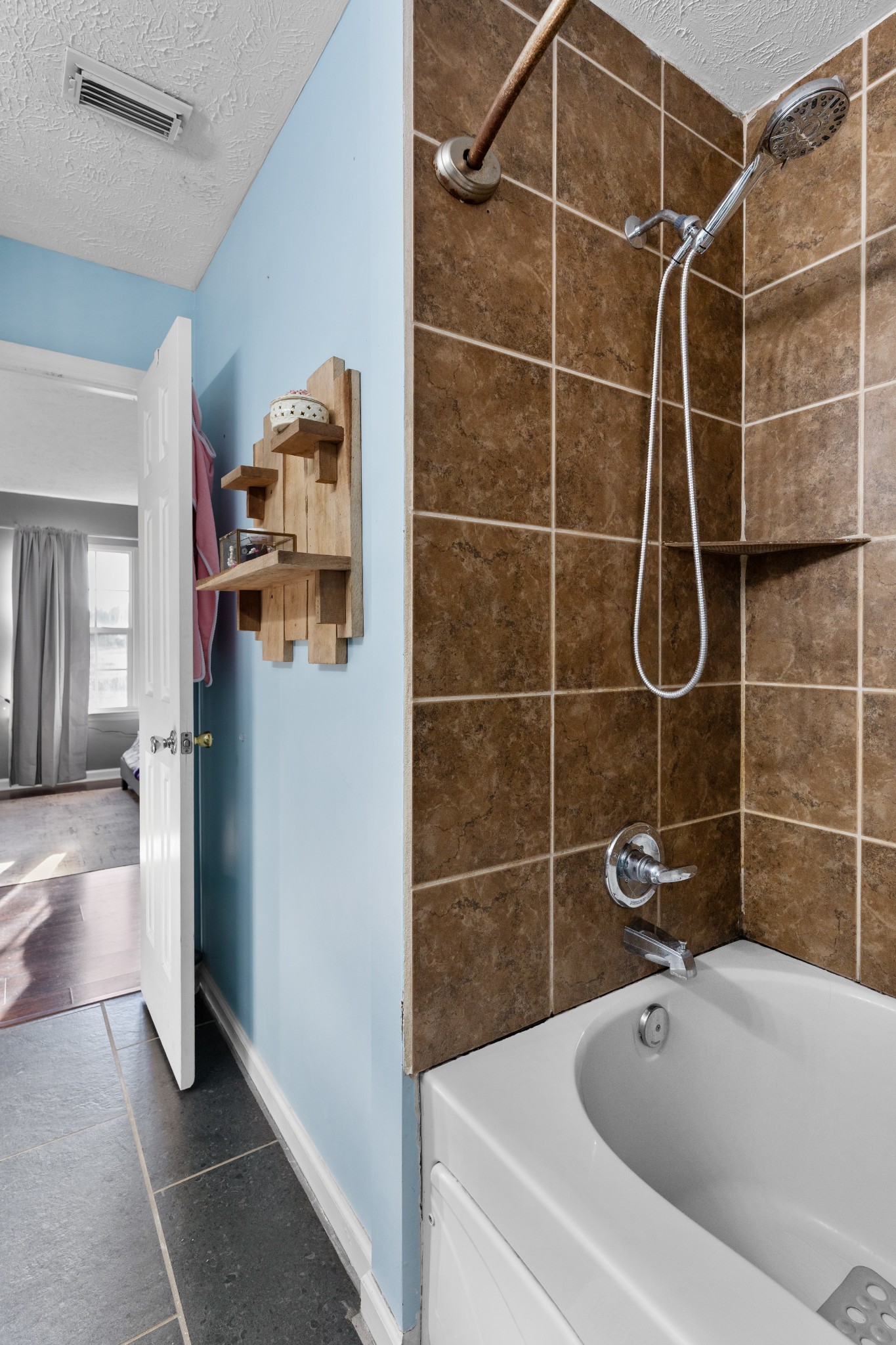 590 Jackson Hollow Road Goodspring, TN 38460 - Photo 26 of 37 a bathroom with a tub and a shower