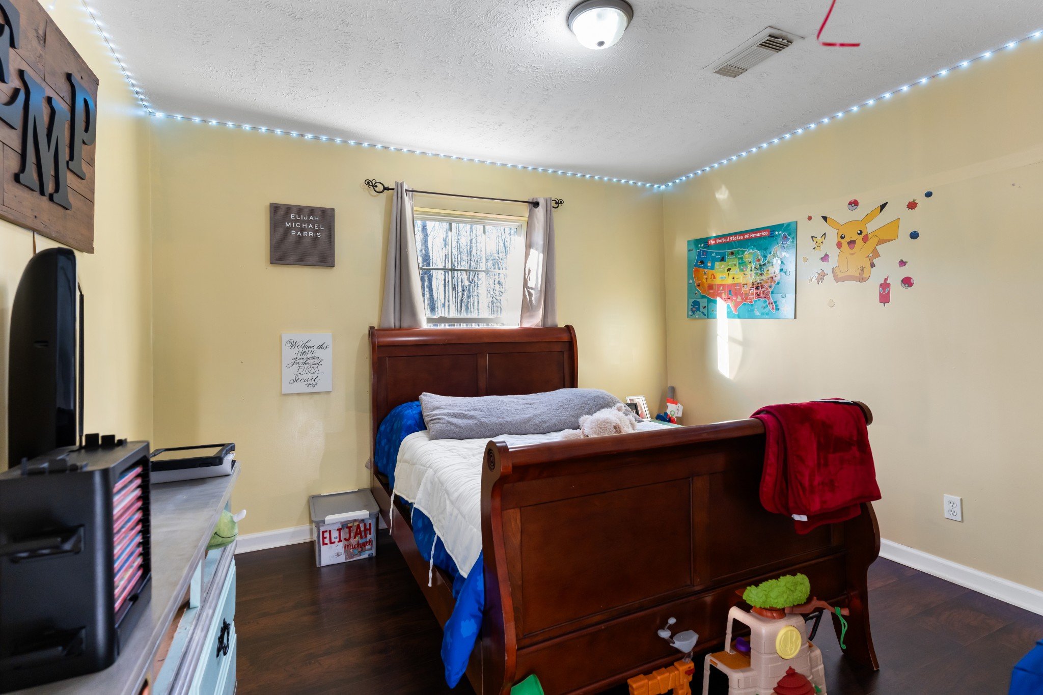 590 Jackson Hollow Road Goodspring, TN 38460 - Photo 33 of 37 a bedroom with a bed and a flat screen tv