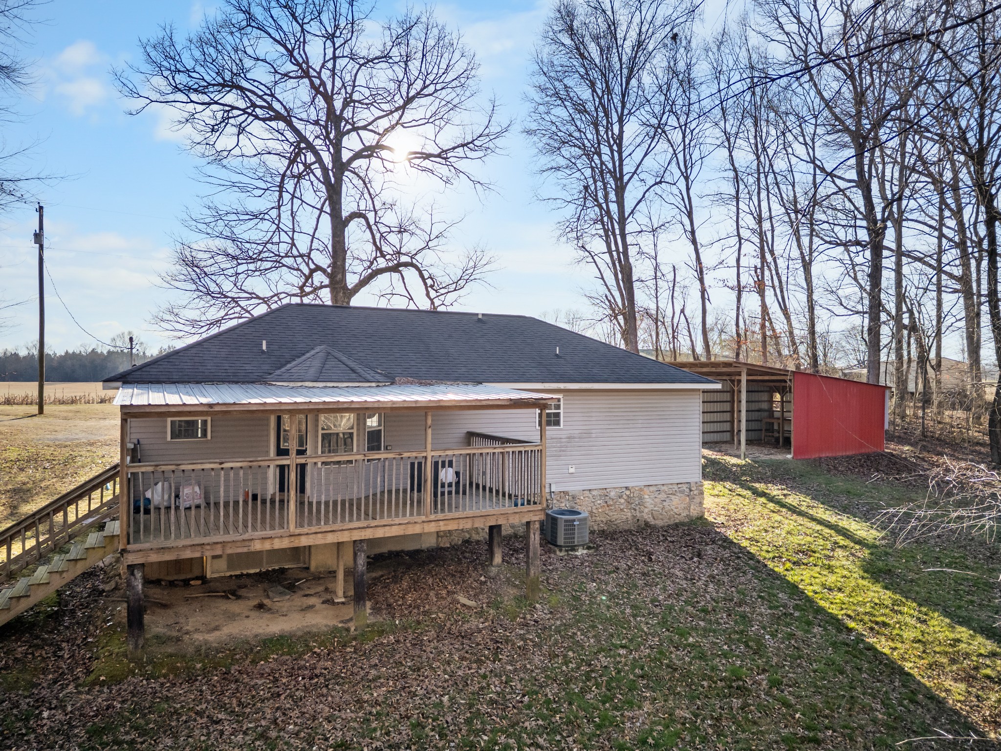 590 Jackson Hollow Road Goodspring, TN 38460 - Photo 36 of 37 a backyard of a house with wooden deck and seating space