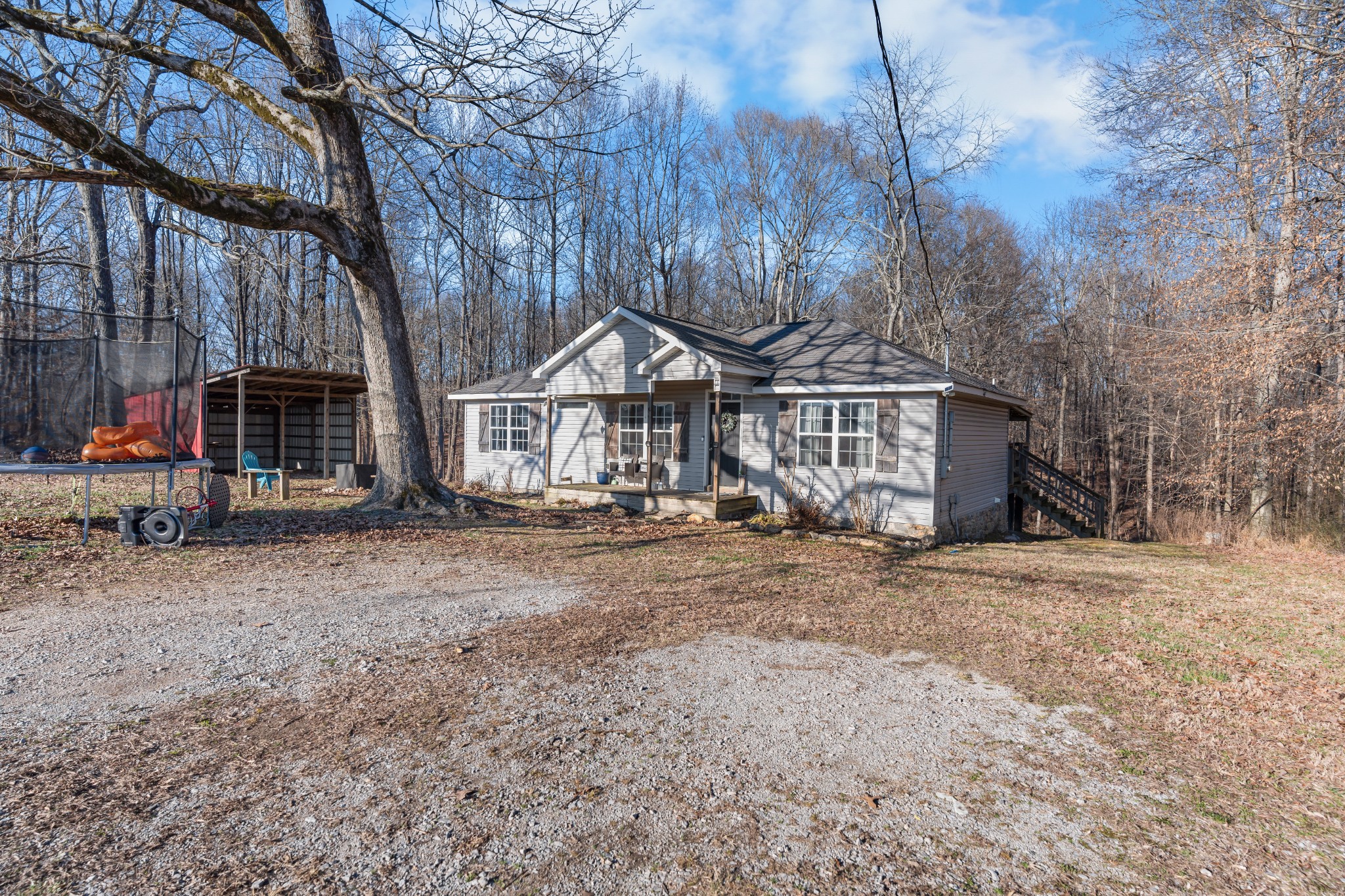 590 Jackson Hollow Road Goodspring, TN 38460 - Photo 8 of 37 a front view of a house with a yard and garage