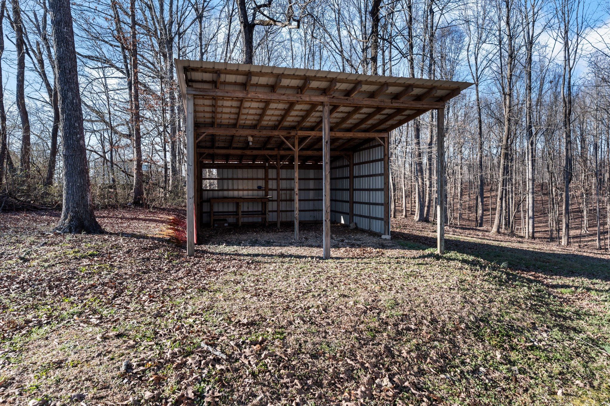 590 Jackson Hollow Road Goodspring, TN 38460 - Photo 9 of 37 a view of a wooden house with a large window and wooden fence