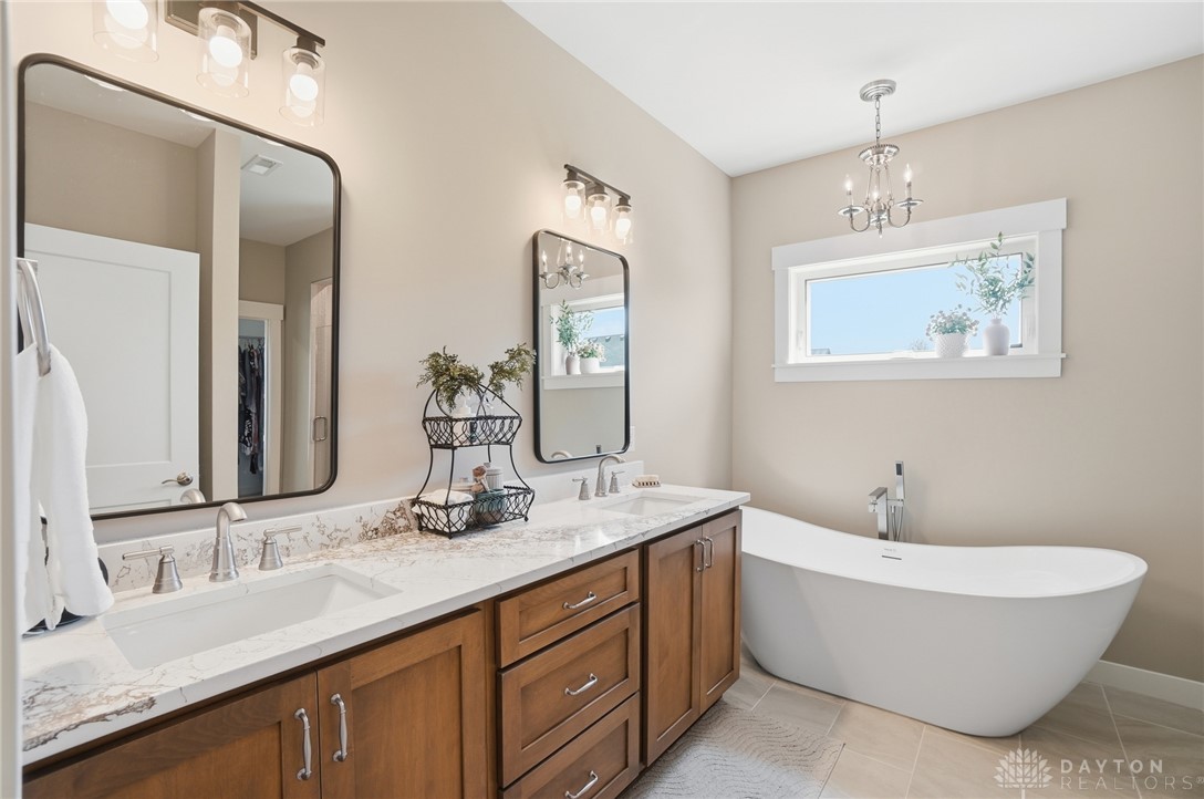 9364 Kenrick Road Dayton, OH 45458 - Photo 23 of 62 This spacious bathroom offers a double vanity and a soaking tub perfect for unwinding after a long day.