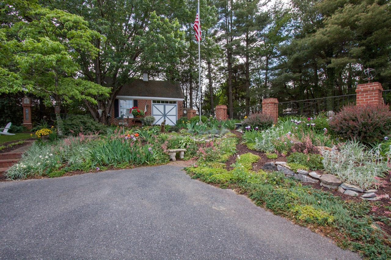 1278 Quick's Mill Road Staunton, VA 24401 - Photo 20 of 75 a backyard of a house with lots of green space and fountain