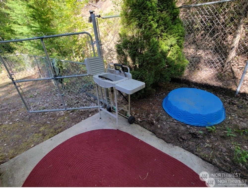 6 Twana Drive Inchelium, WA 99138 - Photo 12 of 18 a view of a chairs in backyard of the house