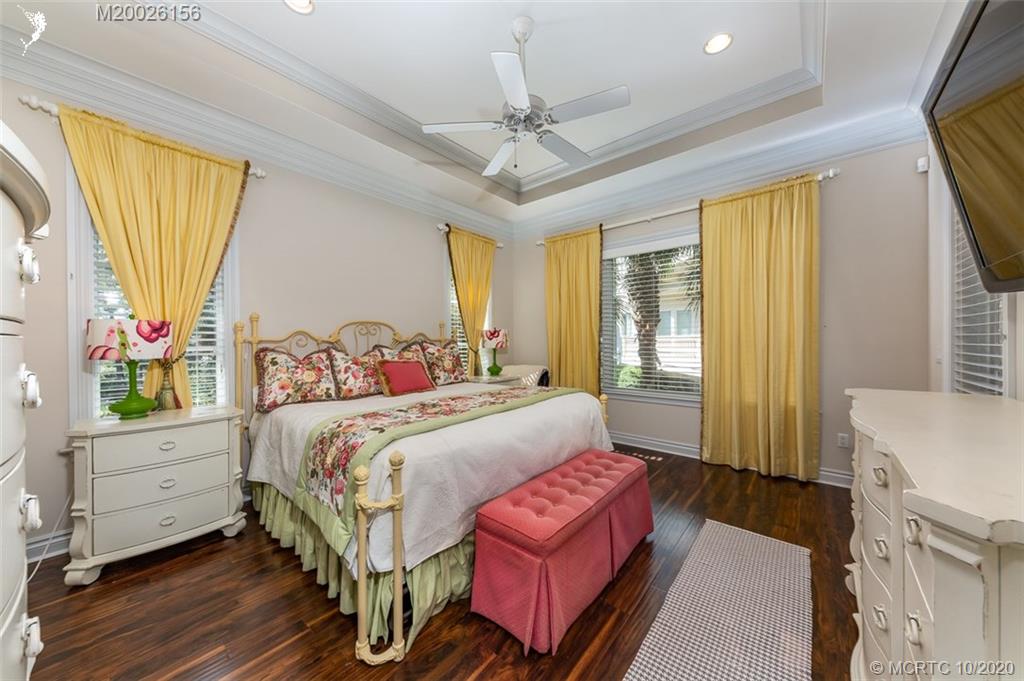 982 Southeast Willoughby Trace, Unit 15 Stuart, FL 34997 - Photo 20 of 36 a bedroom with a bed and a window