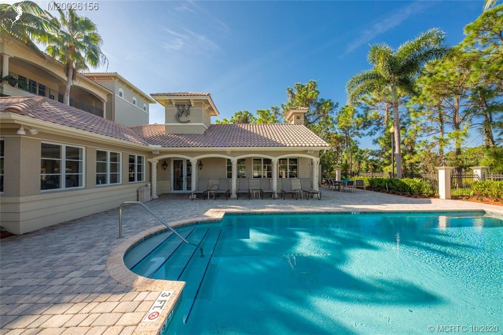 982 Southeast Willoughby Trace, Unit 15 Stuart, FL 34997 - Photo 28 of 36 a view of a house with a yard