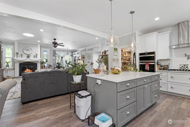 a kitchen with a sink and a stove top oven