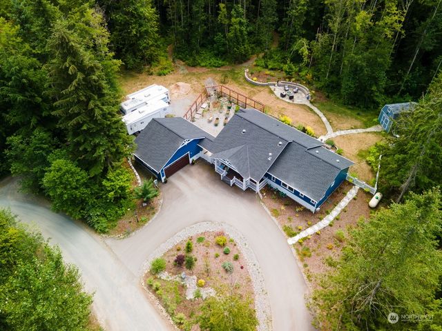 an aerial view of a house with a swimming pool