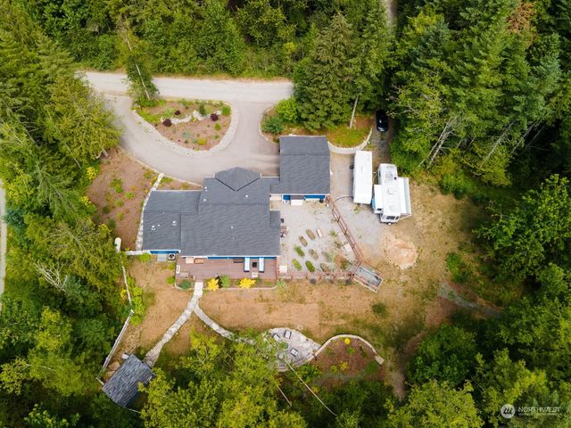 a view of a lake and green valley