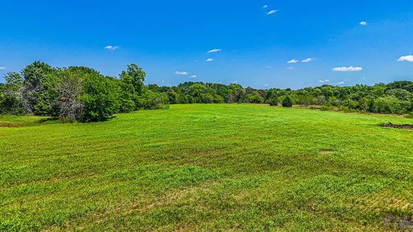 a view of an ocean and a yard