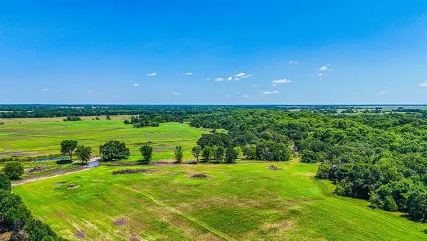a view of a golf course with a big yard