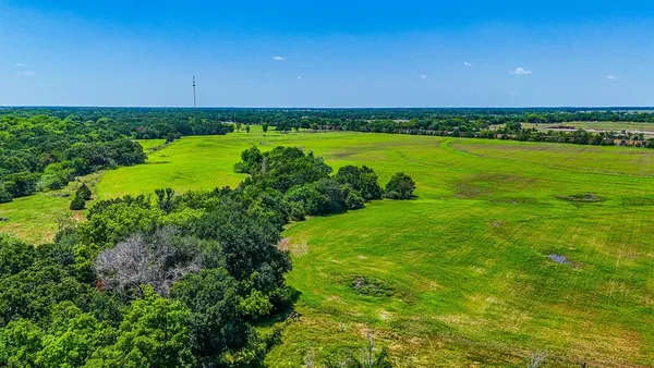 a view of a golf course with a lake