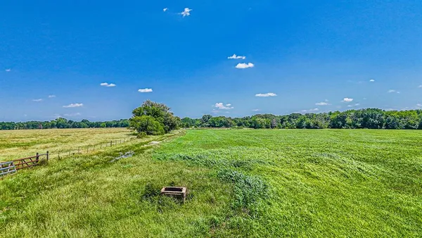 a backyard of a house with lots of green space and garden view