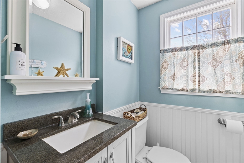 3 Marion Road Scituate, MA 02066 - Photo 13 of 30 a bathroom with a sink vanity mirror and toilet