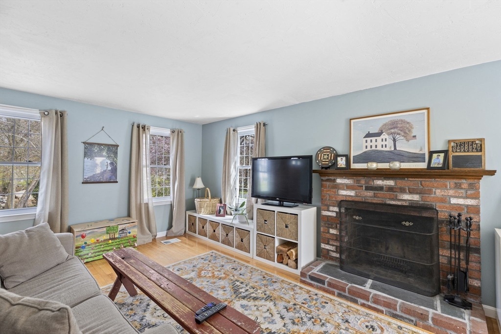 3 Marion Road Scituate, MA 02066 - Photo 16 of 30 a living room with furniture and a flat screen tv