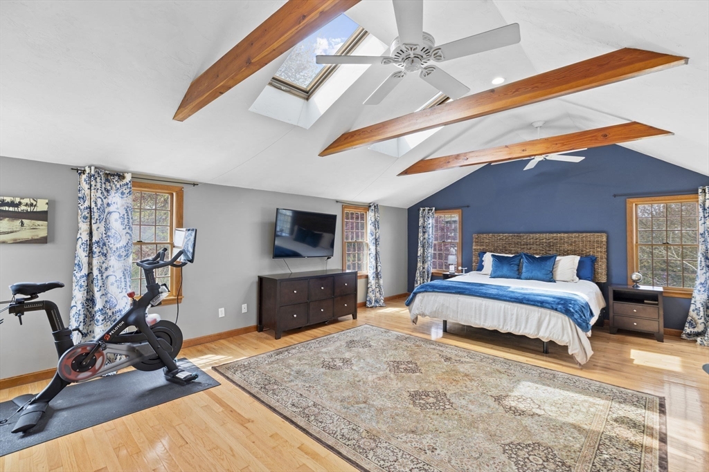 3 Marion Road Scituate, MA 02066 - Photo 20 of 30 a bedroom with a bed a dresser and flat screen tv